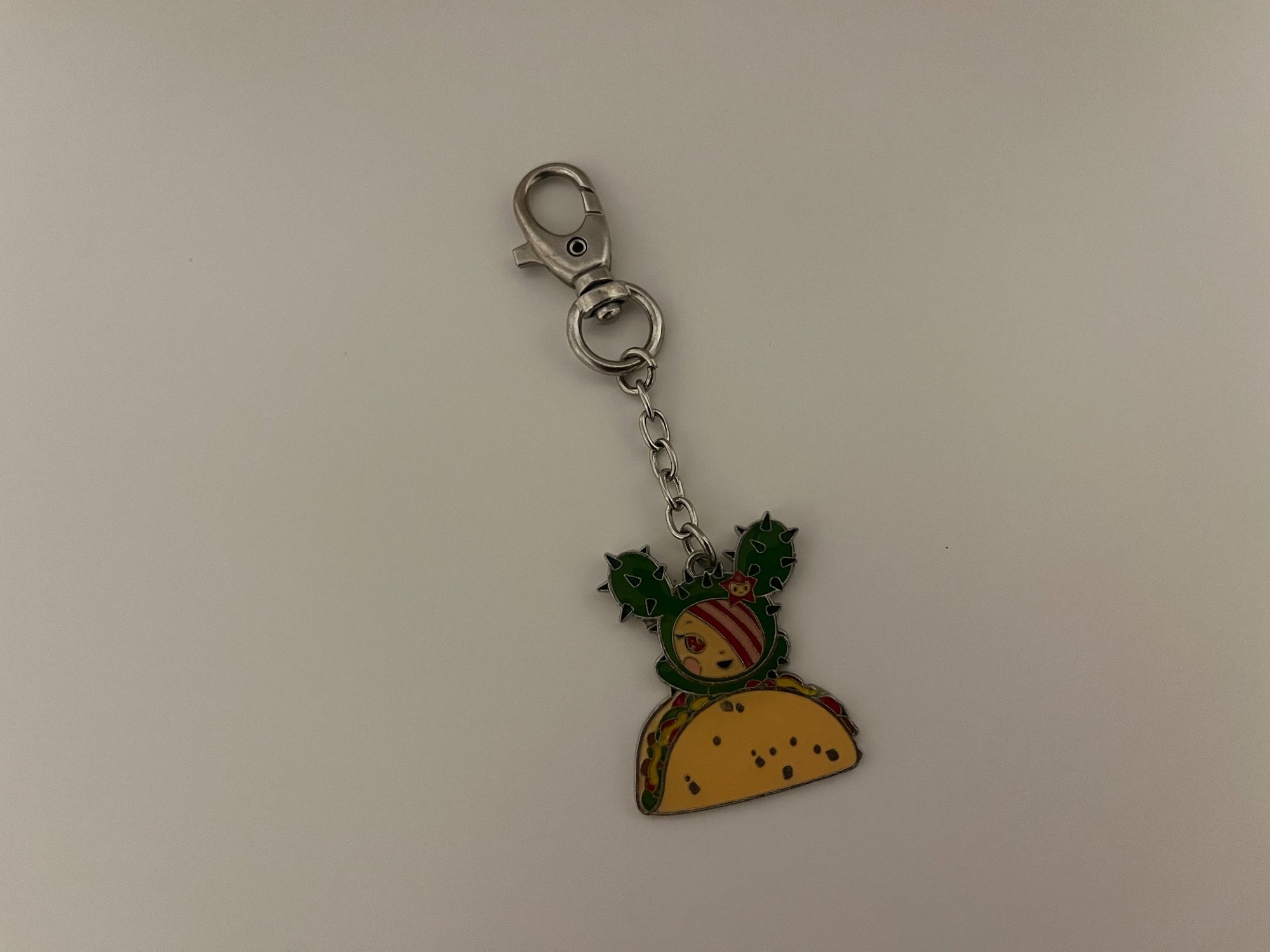 652eb54139e4ab4dc3c1b6b7_sandy-with-taco-metal-charm_1746679939960.jpg