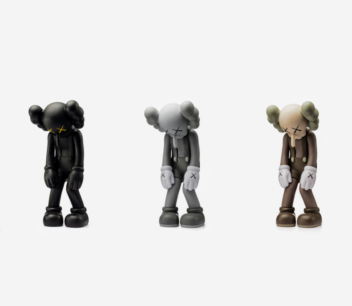 Kaws Small Lie Vinyl Figures - Set of 3 - Black, Grey and Brown